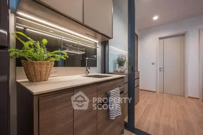 Modern kitchen with sleek cabinets and stylish lighting