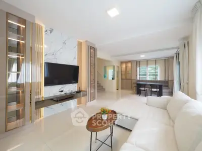 Spacious modern living room with elegant marble wall and cozy seating area