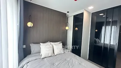Modern bedroom with stylish lighting and sleek closet design