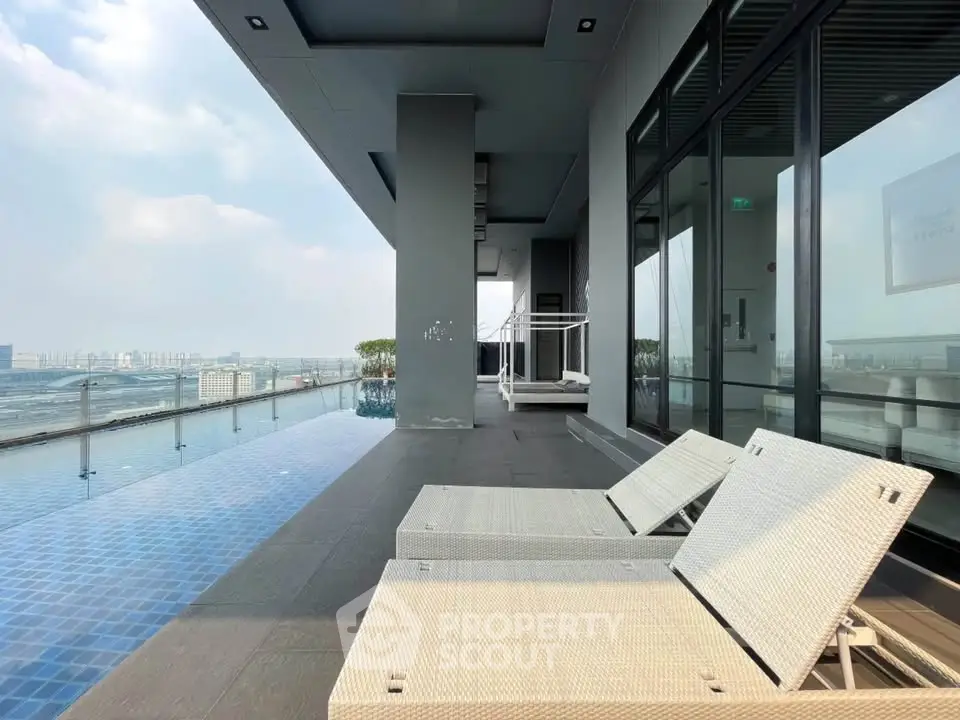 Luxurious rooftop pool area with stunning city views and modern lounge chairs.