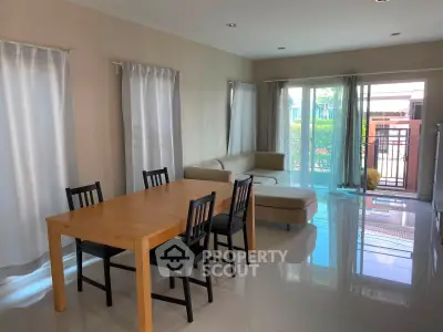 Spacious living room with modern furniture and large windows for natural light.
