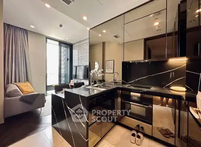 Luxurious modern kitchen with sleek black marble countertops and open layout in stylish apartment.