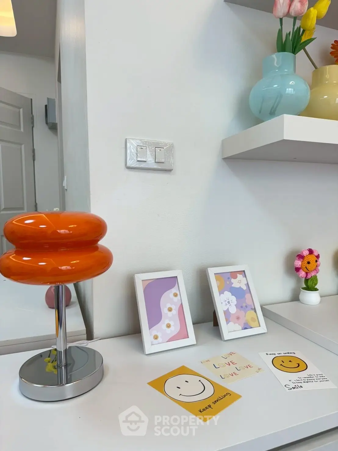 Stylish modern interior with vibrant decor and wall art in a cozy room.