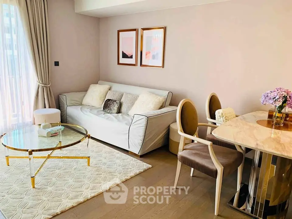 Elegant living room with modern decor, featuring a cozy sofa, stylish dining area, and soft natural lighting.