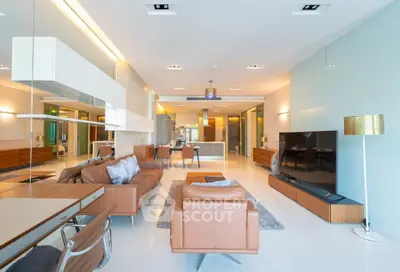 Luxurious modern living room with sleek furniture and open layout, perfect for entertaining.