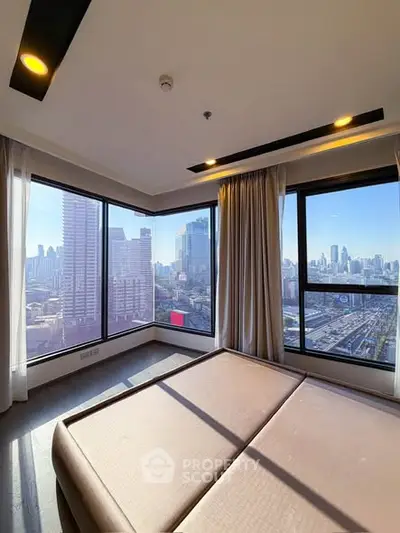 Stunning corner unit bedroom with panoramic city views and floor-to-ceiling windows.