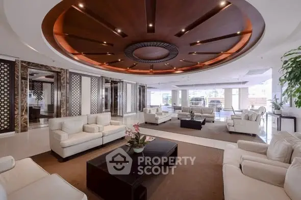 Luxurious modern living room with elegant decor and spacious seating area.