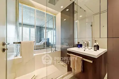 Luxurious modern bathroom with glass shower and elegant fixtures