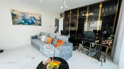 Modern living room with stylish decor and glass display cabinets