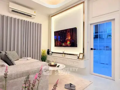 Stylish living room with modern decor and wall-mounted TV