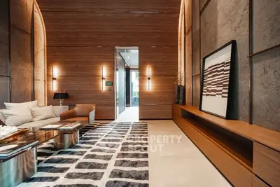 Luxurious modern living room with high ceilings and elegant wooden accents.
