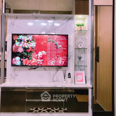 Stylish living room with modern TV setup and festive decor