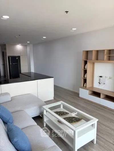 Modern living room with stylish furniture and open layout design.