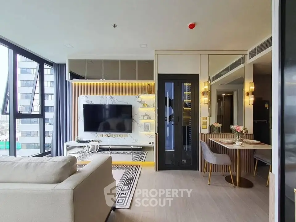 Modern living room with stylish decor and large windows offering city views