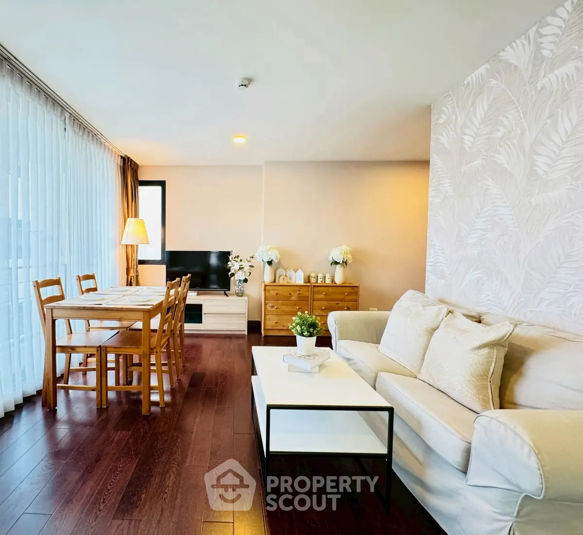 Spacious living room with elegant decor and natural light