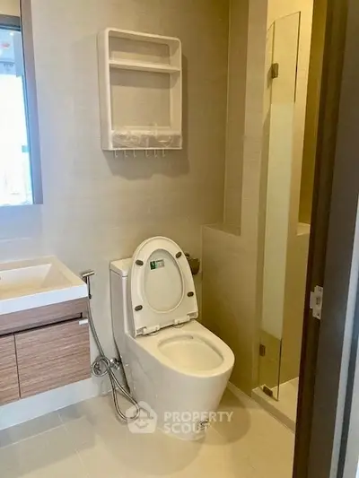 Modern bathroom with sleek fixtures and glass shower enclosure