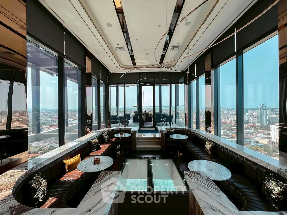 Luxurious rooftop lounge with panoramic city views and elegant seating.
