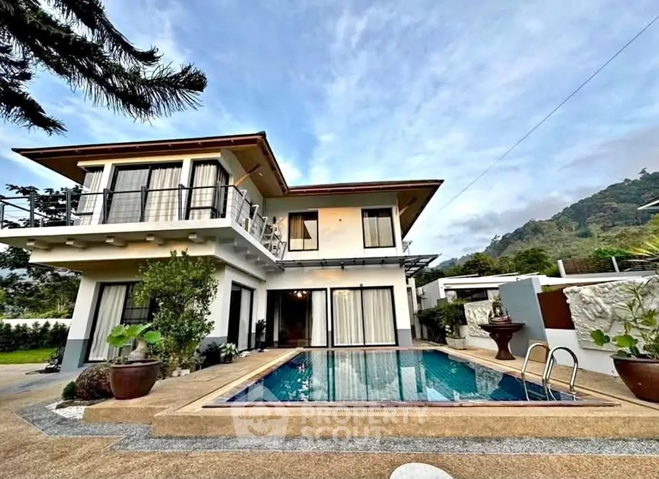 Luxurious two-story villa with private pool and mountain views, perfect for serene living.