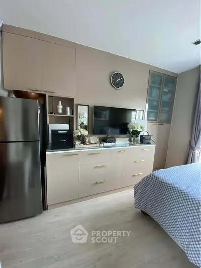 Modern bedroom with built-in storage and sleek decor