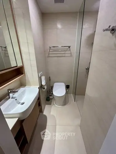 Modern bathroom with sleek design and elegant fixtures in a contemporary apartment.
