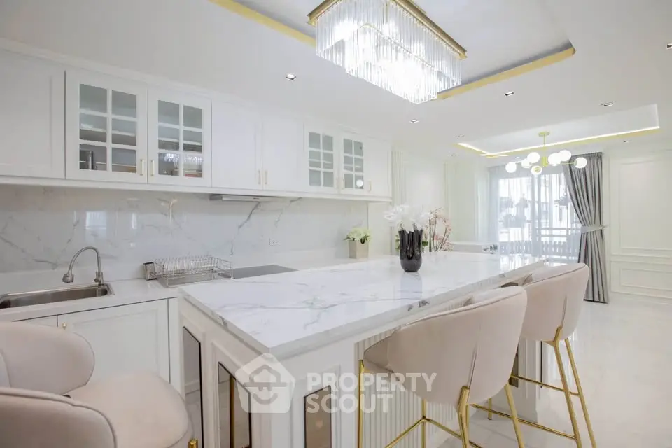 Luxurious modern kitchen with marble countertops and elegant lighting