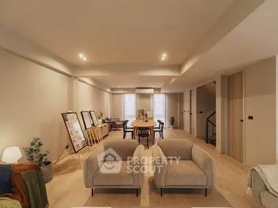 Spacious modern living room with elegant decor and ample natural light, perfect for relaxation and entertainment.
