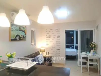 Modern open-plan living room with stylish decor and cozy ambiance.