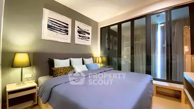 Modern bedroom with stylish decor and ample natural light