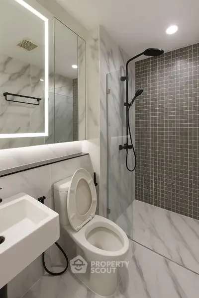 Modern bathroom with marble tiles and sleek shower design