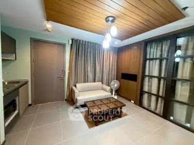 Modern living room with cozy sofa, wooden ceiling, and stylish lighting in a contemporary apartment.