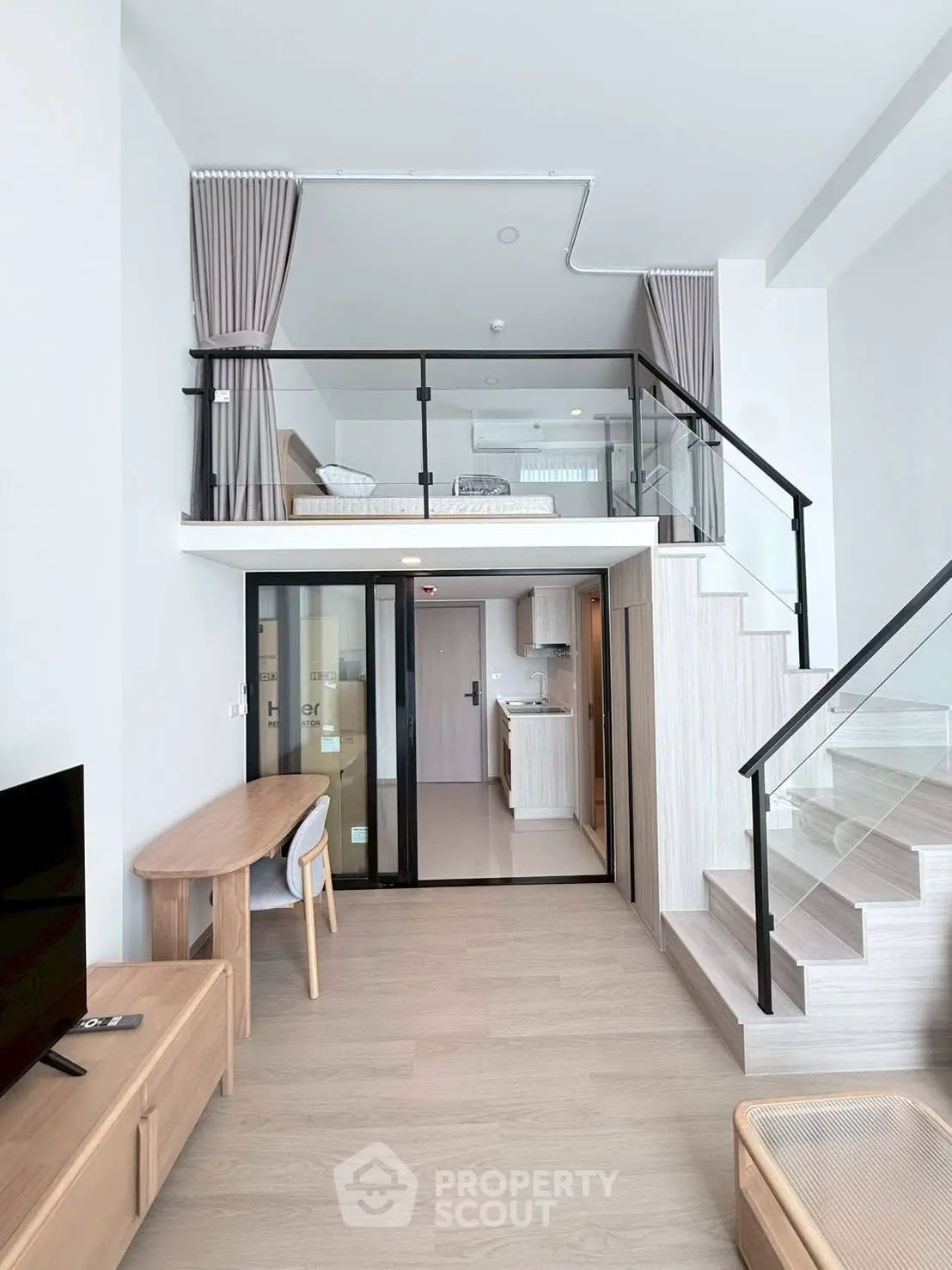 Modern loft apartment with stylish mezzanine bedroom and open living area