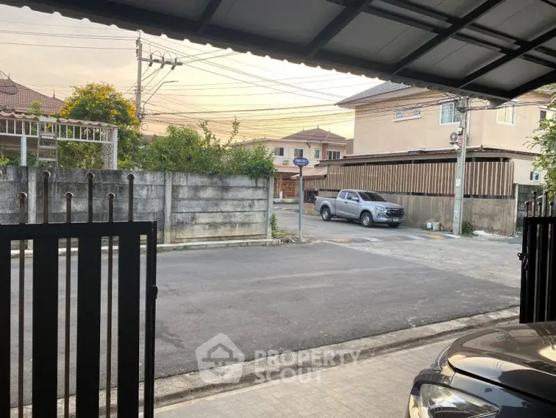 Charming suburban street view from a cozy residential driveway, perfect for family living.