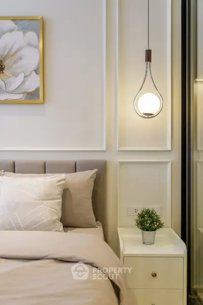 Elegant bedroom with modern lighting and stylish decor