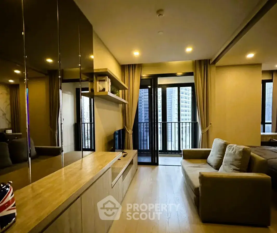 Modern living room with large windows and city view, featuring cozy sofa and stylish decor.