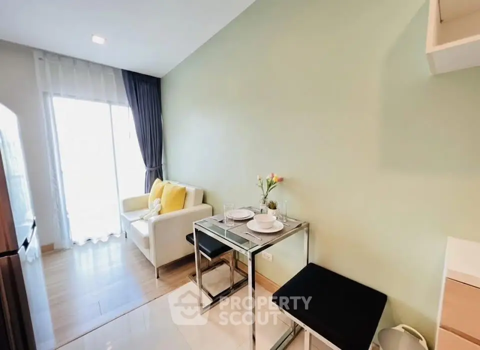 Modern living room with cozy seating and dining area, featuring bright decor and natural light.