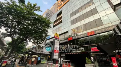 Modern commercial building exterior with McDonald's signage in urban setting
