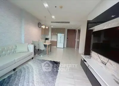Spacious modern living room with open kitchen and stylish decor