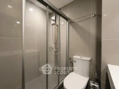 Modern bathroom with sleek shower enclosure and contemporary fixtures