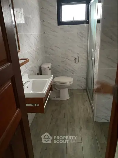 Modern bathroom with sleek shower and elegant tile design