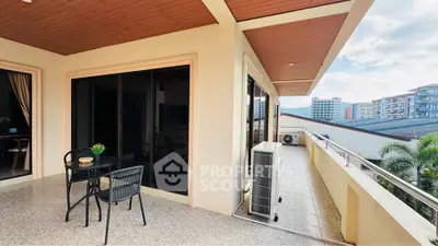 Spacious balcony with outdoor seating and city view, perfect for relaxation and entertainment.