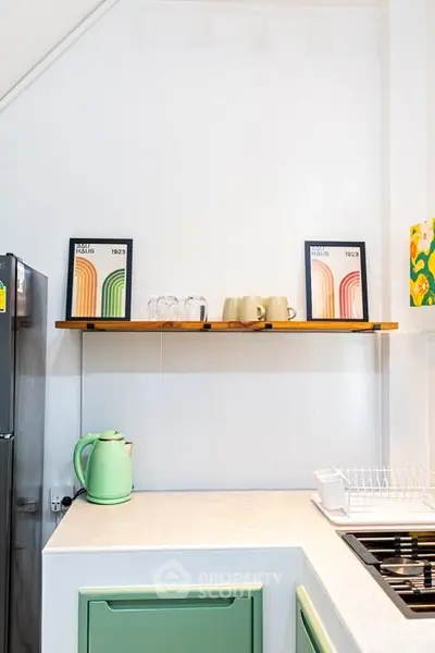 Modern kitchen with green accents and stylish decor