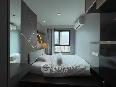Modern bedroom with large window and stylish decor in urban apartment