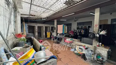 Spacious outdoor area with laundry facilities and storage space in a residential property.