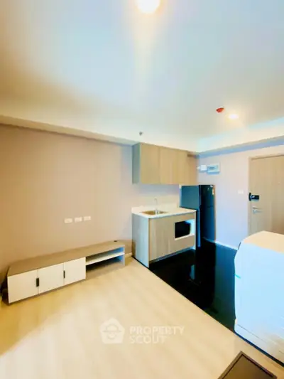 Modern apartment interior with compact kitchen and sleek design
