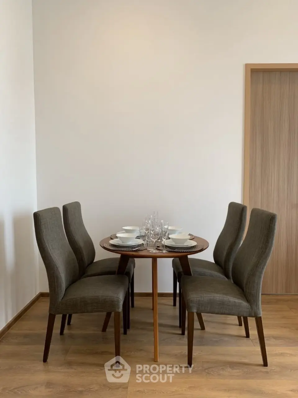 Elegant dining area with modern table and chairs, perfect for intimate gatherings.