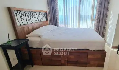 Spacious bedroom with elegant wooden bed frame and natural light