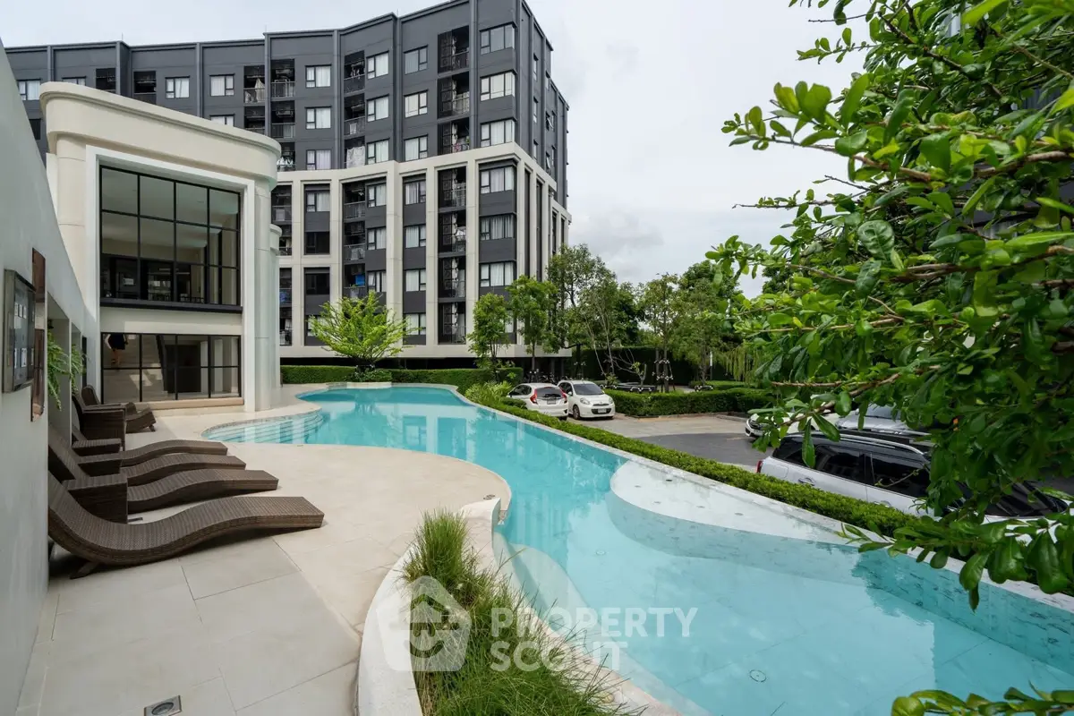 Luxurious apartment complex with stunning pool and modern architecture