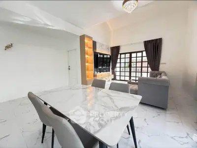 Spacious modern living room with elegant marble flooring and stylish furniture