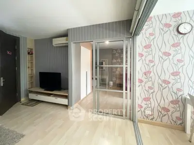 Modern living room with stylish wallpaper and sliding glass doors
