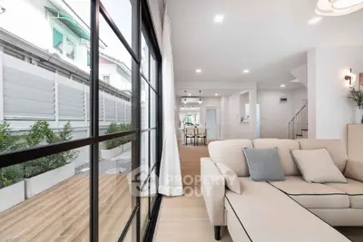 Modern living room with open layout and garden view